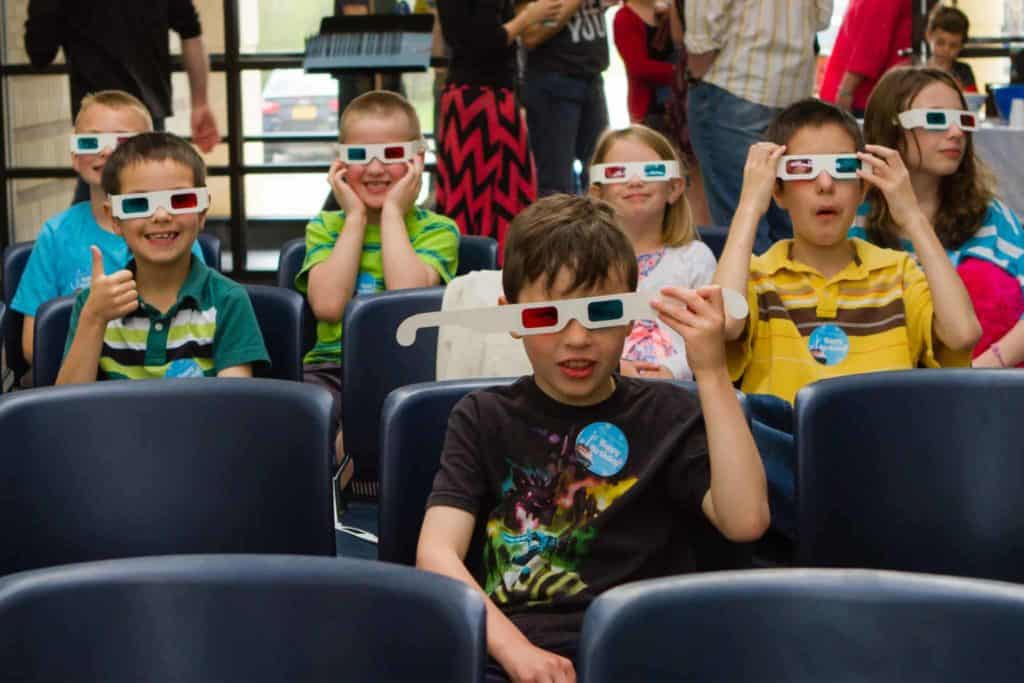 Three Thoughts After One Year • Riverwood Church Two children wearing 3D glasses at a Kids Creek children's ministry event at Riverwood Church.